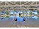 A lovely dock over the water with beautiful views and a white, geometric, metal awning at 295 Calm Water Way, Summerville, SC 29486