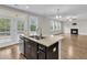 Kitchen features granite countertops, island, and stainless steel appliances at 295 Calm Water Way, Summerville, SC 29486