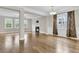 Open concept living room with hardwood floors and a cozy fireplace at 295 Calm Water Way, Summerville, SC 29486