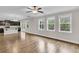 Spacious living room with wood floors, connected to the kitchen at 295 Calm Water Way, Summerville, SC 29486