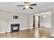 Open living room with fireplace and wood floors, bathed in natural light at 295 Calm Water Way, Summerville, SC 29486