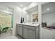 Bright bathroom with double vanity, framed mirror, and stylish decor at 296 Firewheel Ct, Summerville, SC 29486