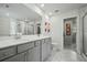 Bright bathroom with double vanity, tile floors, and modern fixtures at 296 Firewheel Ct, Summerville, SC 29486