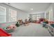 Large bonus room with carpet and windows with plenty of space for play at 296 Firewheel Ct, Summerville, SC 29486