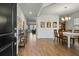 Inviting entryway showcasing hardwood floors leading to a dining area and living room at 296 Firewheel Ct, Summerville, SC 29486
