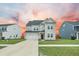 Charming two-story home with gray siding, well-manicured lawn, and attached two-car garage at 296 Firewheel Ct, Summerville, SC 29486