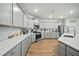 Modern kitchen with stainless steel appliances, gray cabinets, quartz counters, and a kitchen island at 296 Firewheel Ct, Summerville, SC 29486