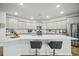 Spacious kitchen with stainless steel appliances, breakfast bar with seating, quartz counters and undermount sink at 296 Firewheel Ct, Summerville, SC 29486