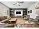 Inviting living room with built-in shelving, cozy seating, and a ceiling fan at 296 Firewheel Ct, Summerville, SC 29486