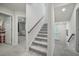 Bright staircase with carpet, wood handrail, and access to different floors at 296 Firewheel Ct, Summerville, SC 29486