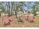 Spacious backyard fire pit with Adirondack chairs, ideal for outdoor gatherings and relaxation at 301 E Richardson Ave, Summerville, SC 29483