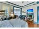 Bedroom featuring hardwood flooring, a fireplace, and a sitting area at 301 E Richardson Ave, Summerville, SC 29483