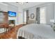 Spacious bedroom featuring hard wood floors, a decorative fireplace, and abundant natural light at 301 E Richardson Ave, Summerville, SC 29483