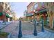 Charming downtown street with historic buildings and brick-paved road with benches and planters for pedestrians at 301 E Richardson Ave, Summerville, SC 29483