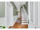 Inviting entryway with hardwood floors, staircase, and classic decor at 301 E Richardson Ave, Summerville, SC 29483