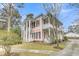 Two-story home featuring columns, double porches and staircase at 301 E Richardson Ave, Summerville, SC 29483