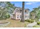 Two-story home featuring columns, bay window, and side yard at 301 E Richardson Ave, Summerville, SC 29483