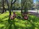 Cozy backyard fire pit area with Adirondack chairs at 301 E Richardson Ave, Summerville, SC 29483