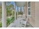 Inviting front porch with rocking chairs, columns, and manicured landscaping at 301 E Richardson Ave, Summerville, SC 29483
