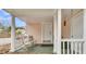 Inviting front porch with comfortable seating and a welcoming entrance to the home at 301 E Richardson Ave, Summerville, SC 29483