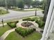 Landscaped front yard features flowerbeds and a decorative fountain, enhancing the property's curb appeal at 301 E Richardson Ave, Summerville, SC 29483