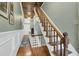 Detailed view of the hallway with hardwood floors and a staircase at 301 E Richardson Ave, Summerville, SC 29483