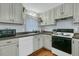 Kitchen with lots of cabinet space and a hardwood floor at 301 E Richardson Ave, Summerville, SC 29483