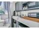 Convenient kitchenette area with modern appliances, countertop space, and natural light at 301 E Richardson Ave, Summerville, SC 29483