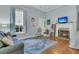 Comfortable living room featuring a decorative fireplace, soft lighting, and stylish accents at 301 E Richardson Ave, Summerville, SC 29483