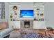 Comfortable living room features a brick fireplace, built-in shelving, and stylish decor at 301 E Richardson Ave, Summerville, SC 29483