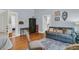 Inviting living room showcasing a cozy couch and a doorway view to the kitchen at 301 E Richardson Ave, Summerville, SC 29483