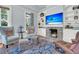 Cozy living room featuring fireplace, built-in shelves, and armchairs at 301 E Richardson Ave, Summerville, SC 29483