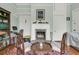 Cozy living room with a brick fireplace and traditional decor at 301 E Richardson Ave, Summerville, SC 29483