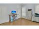 Well-lit office with a decorative fireplace and a desk with office equipment at 301 E Richardson Ave, Summerville, SC 29483