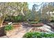 Charming park with benches, brick planters, and a statue, creating a relaxing outdoor space at 301 E Richardson Ave, Summerville, SC 29483