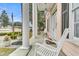 Inviting front porch with elegant white columns and rocking chairs at 301 E Richardson Ave, Summerville, SC 29483