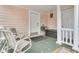Inviting porch area with chairs and neutral-toned paint at 301 E Richardson Ave, Summerville, SC 29483
