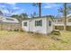 Exterior view of a well-maintained storage shed featuring green shutters and a secure door at 301 E Richardson Ave, Summerville, SC 29483