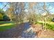 Inviting walking path lined with trees and lush grass, perfect for a serene outdoor experience at 301 E Richardson Ave, Summerville, SC 29483
