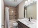 Bright bathroom showcases a shower/tub combo, vanity with a modern sink and fixtures at 303 Hamlet Rd, Summerville, SC 29485