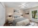 Bedroom with neutral paint, plush bed, side tables, and a large window overlooking lush greenery at 303 Hamlet Rd, Summerville, SC 29485