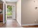 Inviting foyer featuring wood-look floors and a view of the outdoors through the storm door at 303 Hamlet Rd, Summerville, SC 29485