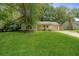 Charming single-story home with manicured front yard and attached garage at 303 Hamlet Rd, Summerville, SC 29485