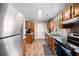 Well-lit kitchen featuring granite counters and stainless steel appliances at 303 Hamlet Rd, Summerville, SC 29485