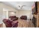 Spacious living room with a brick fireplace and wood-look flooring at 303 Hamlet Rd, Summerville, SC 29485