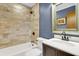 Updated bathroom with a shower-over-tub, vanity, and framed mirror at 305 Driver Ave, Summerville, SC 29483