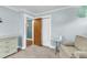 Comfortable bedroom featuring an armchair, neutral paint, and view to a hallway at 305 Driver Ave, Summerville, SC 29483