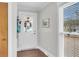 Bright entryway showcasing a white front door, wood floors, and natural light from the windows at 305 Driver Ave, Summerville, SC 29483