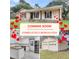 Charming renovated home featuring a modern kitchen and a detached two-car garage at 305 Driver Ave, Summerville, SC 29483