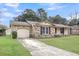 Lovely single-story home with attached garage and a well-maintained lawn and driveway at 305 Driver Ave, Summerville, SC 29483